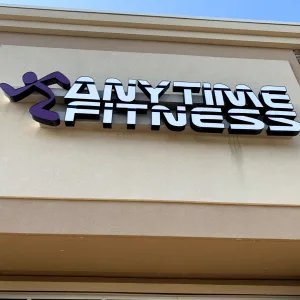 Exterior illuminated logo storefront sign for gym