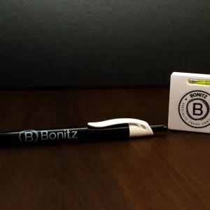 Promotional pen and keychain level with logo