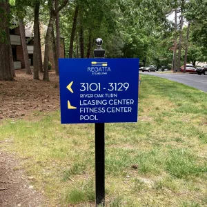 Directional post sign for apartment complex