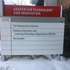 Exterior branded office name address sign