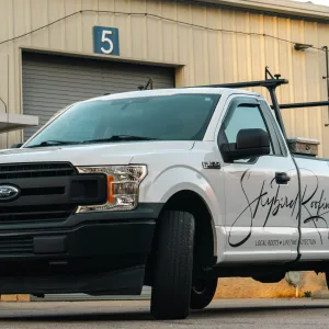 Business truck with company information decals
