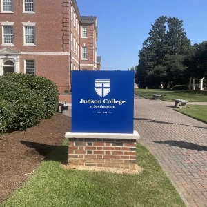 Monument entrance sign for college walking path